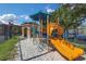 Community playground with blue and yellow play structure featuring slides and climbing features at 2730 Via Tivoli # 321B, Clearwater, FL 33764