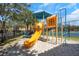Community playground with slide, tic-tac-toe, and a sandbox area. Perfect for the ! at 2730 Via Tivoli # 321B, Clearwater, FL 33764