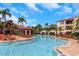 A luxurious swimming pool with lounge chairs and umbrellas offers relaxation and enjoyment on a sunny day at 2730 Via Tivoli # 321B, Clearwater, FL 33764