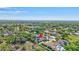Beautiful aerial shot of a home with a pool, surrounded by mature trees, in a quiet residential neighborhood at 2905 Hillside Ramble Dr, Brandon, FL 33511