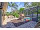 Backyard with outdoor patio, pool, playhouse, and lush landscaping at 2905 Hillside Ramble Dr, Brandon, FL 33511