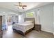 Serene bedroom features wood-look floors, neutral tones, and a separate office nook for productivity at 2905 Hillside Ramble Dr, Brandon, FL 33511