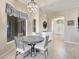 Charming dining area with a modern chandelier and adjacent entryway at 2905 Hillside Ramble Dr, Brandon, FL 33511