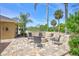 A stone-surrounded fire pit with chair seating, extends leisure outdoors to a backyard offering lush natural views at 2905 Hillside Ramble Dr, Brandon, FL 33511