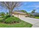 Spacious three-car garage and large driveway, perfect for car enthusiasts or ample parking at 2905 Hillside Ramble Dr, Brandon, FL 33511