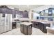 Spacious kitchen with dark cabinets, stainless appliances, and an open layout at 2905 Hillside Ramble Dr, Brandon, FL 33511