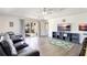 Bright living area boasts wood-look floors, neutral decor, and a sliding door leading to the outdoors at 2905 Hillside Ramble Dr, Brandon, FL 33511