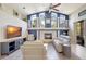 Inviting living room with a vaulted ceiling, fireplace, and large windows at 2905 Hillside Ramble Dr, Brandon, FL 33511