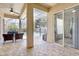 Covered patio with ceiling fan, brick-paved floors, and seamless integration to the pool offers comfort and relaxation at 2905 Hillside Ramble Dr, Brandon, FL 33511