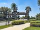 Elegant community entrance with stone accents, lush landscaping, and a welcoming gate, enhancing curb appeal at 30423 Ceasar Park Dr, Wesley Chapel, FL 33543