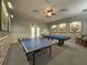 A community game room featuring a pool table, ping pong, and comfortable seating at 30423 Ceasar Park Dr, Wesley Chapel, FL 33543