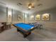 Bright game room featuring a pool table, ping pong table, and modern decor for entertaining friends and Gathering at 30423 Ceasar Park Dr, Wesley Chapel, FL 33543