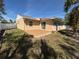 Backyard view highlighting the back patio, landscaping, and home's exterior at 3120 Dole St, Holiday, FL 34691