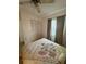 Bedroom that features a bed, ceiling fan, a window with blinds, and a closet at 3120 Dole St, Holiday, FL 34691