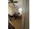 Bedroom that features a ceiling fan, window, closet, a desk with a computer on it at 3120 Dole St, Holiday, FL 34691