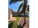 Charming exterior view highlighting the landscaped front yard, walkway, and architectural details at 3120 Dole St, Holiday, FL 34691