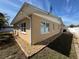 Exterior shot displays the home's siding, roofing, and surrounding landscaping at 3120 Dole St, Holiday, FL 34691