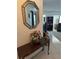 Inviting foyer with console table, mirror, and views into the living areas at 3120 Dole St, Holiday, FL 34691