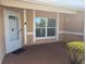 Inviting front porch showing the front door, window, and exterior details at 3120 Dole St, Holiday, FL 34691