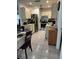 Cozy kitchen featuring stainless steel appliances, tile floors, and ample cabinet space at 3120 Dole St, Holiday, FL 34691