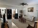 Spacious living room with carpet flooring, comfortable seating, and lots of natural light at 3120 Dole St, Holiday, FL 34691