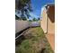 Side yard showcasing the home's exterior, well-maintained landscaping, and new fencing at 3120 Dole St, Holiday, FL 34691