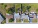 Straight down aerial view shows the property lines and landscaping features of three homes at 3249 Masonville Loop, Holiday, FL 34691