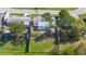 Overhead shot of the property featuring a large backyard, fully fenced, with a boat parked on the side at 3249 Masonville Loop, Holiday, FL 34691