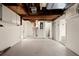 Unfinished basement with concrete floor, open ceiling, and visible utilities at 3249 Masonville Loop, Holiday, FL 34691