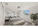 Cozy bedroom with hardwood floors, natural light from a large window, and stylish decor at 3249 Masonville Loop, Holiday, FL 34691