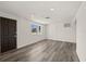 Bright bonus room featuring modern hardwood floors and ample lighting for a comfortable living space at 3249 Masonville Loop, Holiday, FL 34691