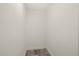 Clean and minimalist closet interior with neutral walls and wood flooring at 3249 Masonville Loop, Holiday, FL 34691