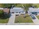 Aerial view highlighting this home's curb appeal with well-maintained landscaping, driveway, and exterior at 3249 Masonville Loop, Holiday, FL 34691