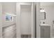Hallway that shows the living area and bathroom with vanity and sink at 3249 Masonville Loop, Holiday, FL 34691