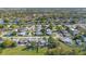 Aerial view of the neighborhood showcasing residential streets, green spaces, and proximity to local amenities at 3249 Masonville Loop, Holiday, FL 34691