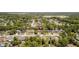 A neighborhood view with mature trees and a red location pin marking the property's location in the community at 3276 Morven Dr, Spring Hill, FL 34609