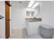 Updated bathroom with granite countertop vanity, modern fixtures and lighting at 3276 Morven Dr, Spring Hill, FL 34609