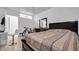 Bright bedroom with a ceiling fan, tile floor, a desk, and natural light at 3276 Morven Dr, Spring Hill, FL 34609