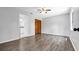 Bedroom with wood look flooring, ceiling fan, and a closet at 3276 Morven Dr, Spring Hill, FL 34609