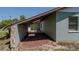 Exterior side view of the home featuring stone accents, brown trim, and lush landscaping around the perimeter at 3276 Morven Dr, Spring Hill, FL 34609