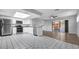 Sunlit kitchen featuring stainless steel appliances, granite countertops, and sliding door to patio at 3276 Morven Dr, Spring Hill, FL 34609