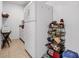 Kitchenette with full-size refrigerator, storage rack, and pantry at 3276 Morven Dr, Spring Hill, FL 34609