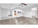View of an open-concept living room with a view into kitchen at 3276 Morven Dr, Spring Hill, FL 34609