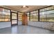Spacious sun room surrounded by windows, providing serene views of the outdoors at 3276 Morven Dr, Spring Hill, FL 34609
