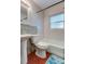 Standard bathroom featuring a bathtub, shower, toilet, sink and wood floor at 337 Shore E Dr, Oldsmar, FL 34677