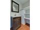 Bathroom featuring a sleek vanity, modern fixtures, and convenient built in shelving at 337 Shore E Dr, Oldsmar, FL 34677