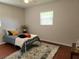 Bright bedroom featuring a neutral decor, wood floor and lots of light at 337 Shore E Dr, Oldsmar, FL 34677