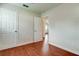 Bedroom view showcases hardwood floors, neutral walls, and interior doors, offering comfortable living at 337 Shore E Dr, Oldsmar, FL 34677