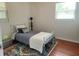 Cozy bedroom with bright natural light and a colorful accent rug at 337 Shore E Dr, Oldsmar, FL 34677