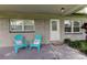 Welcoming front entrance with seating, decorative glass front door, and a 'Welcome' doormat at 337 Shore E Dr, Oldsmar, FL 34677